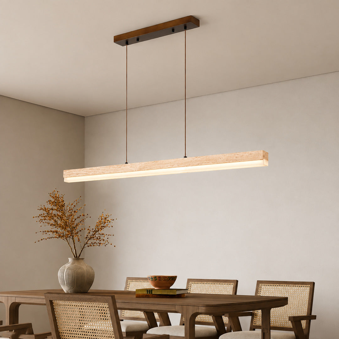 Sole travertine pendant light large dining table oversized warm glow natural travertine stone disc statement American home lifestyle interior styled
