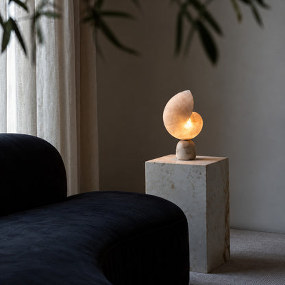 Spira alabaster shell lamp on a mid-century credenza in a living room
