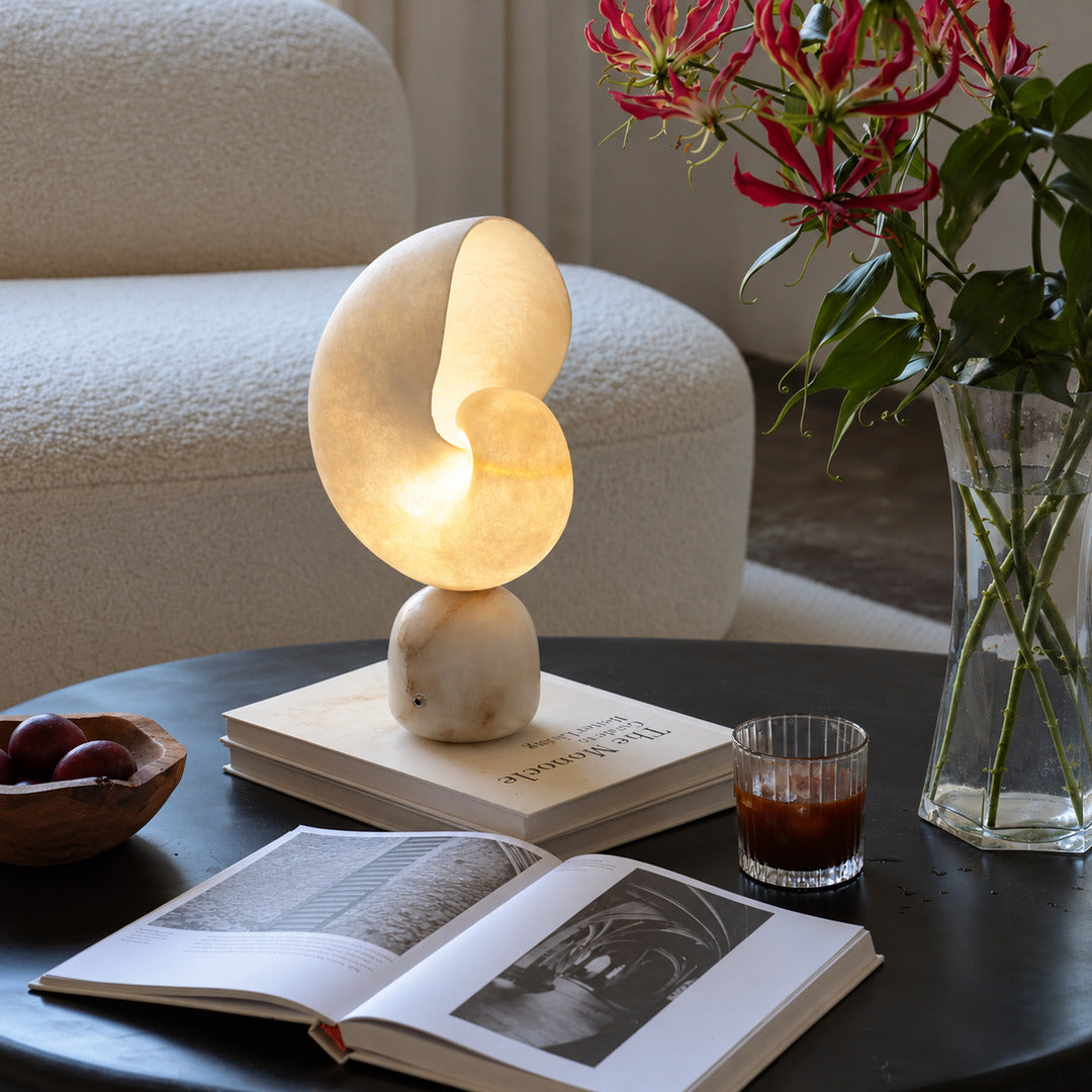 Spira alabaster table lamp on the corner of a home office desk