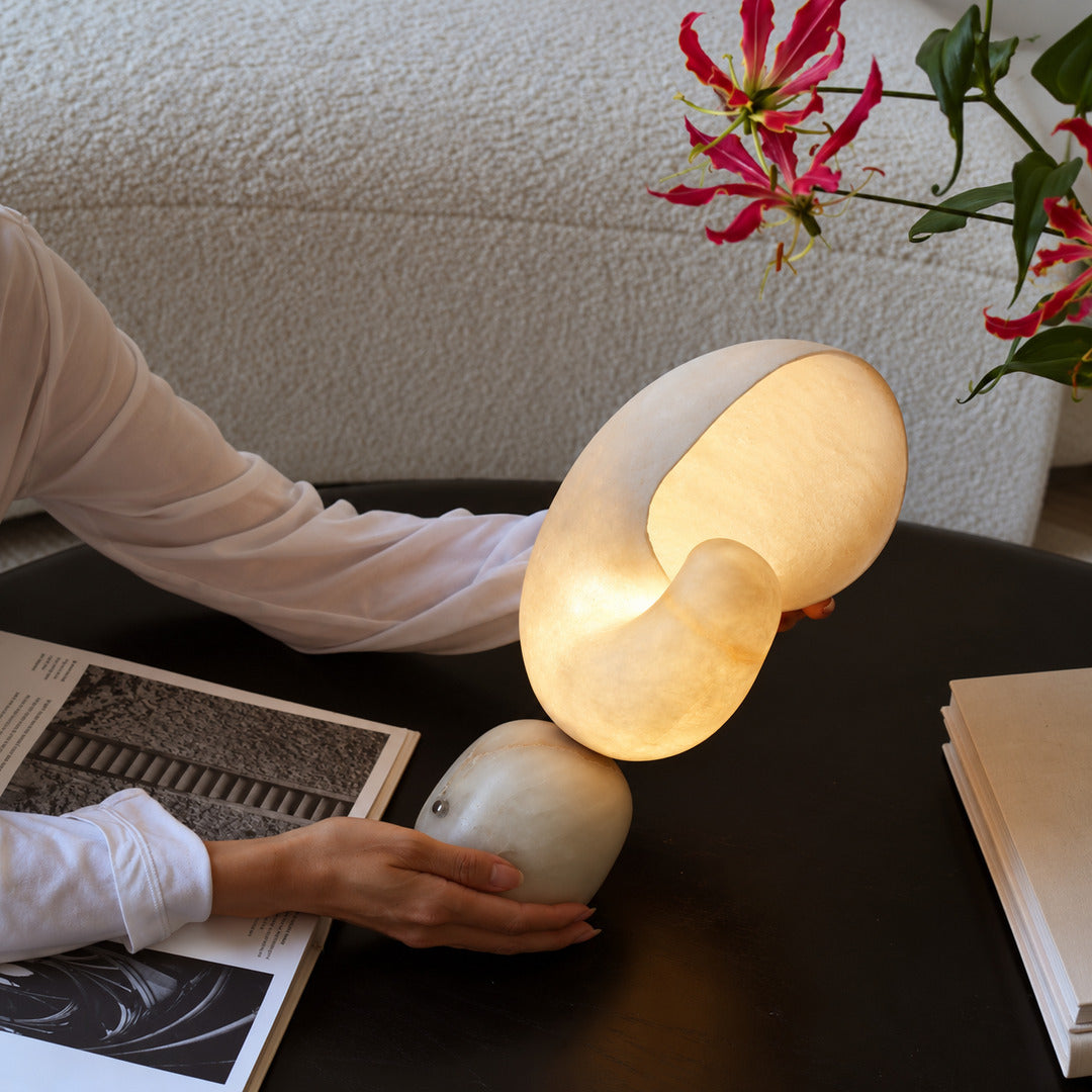 Spira alabaster table lamp on the corner of a home office desk