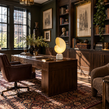 Spira alabaster table lamp on the corner of a home office desk