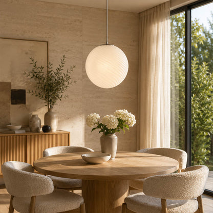 Spira pendant light pink single modern breakfast nook small table hand blown spiral ribbed glass sphere colorful cheerful cozy warm ambient lifestyle interior American home