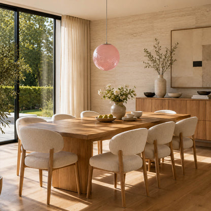 Spira pendant light yellow single modern dining room round wood table centerpiece hand blown spiral ribbed glass sphere colorful cheerful sunny warm ambient lifestyle interior American home