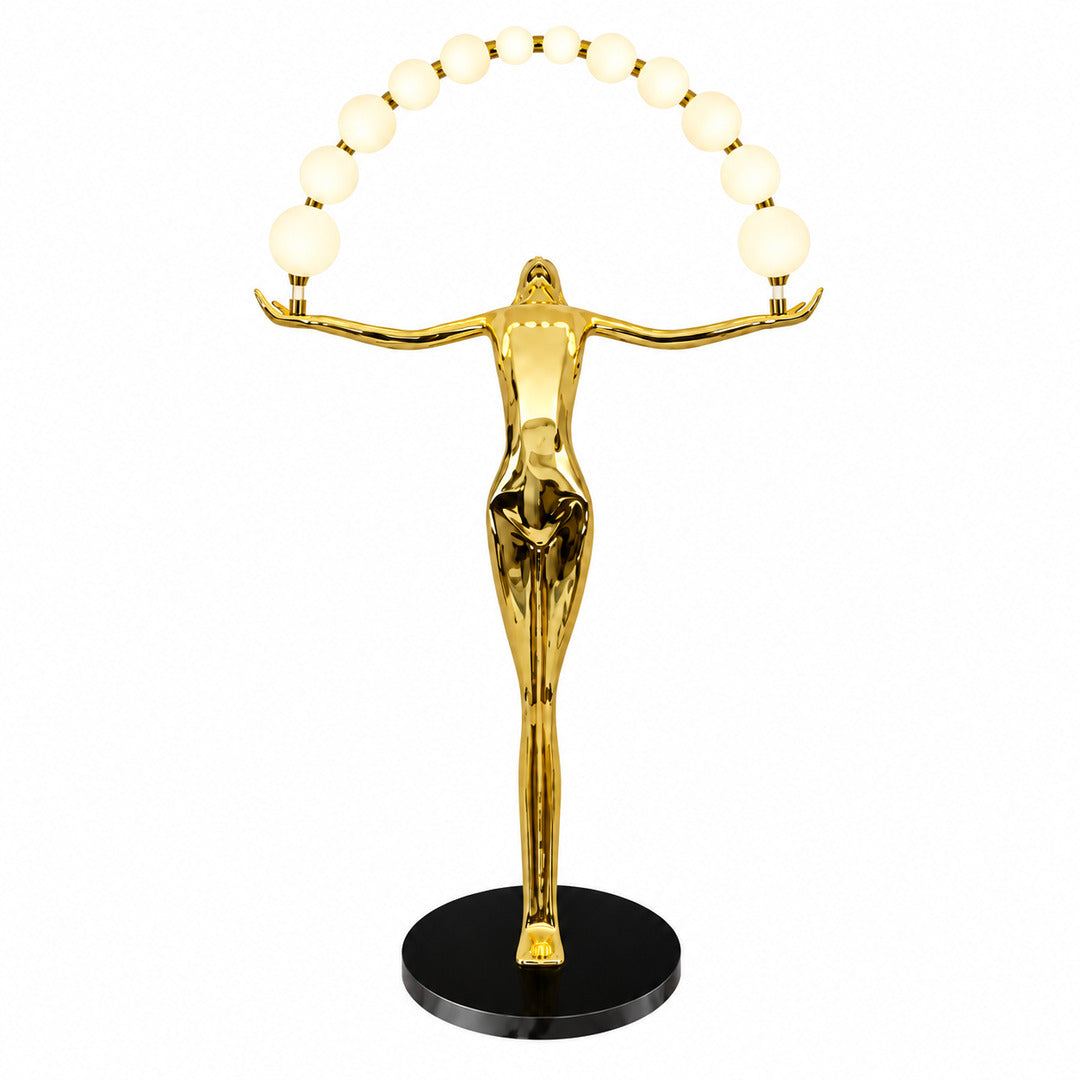 Statue of Liberty floor lamp with a tall figure sculpture holding an arc of glowing glass orbs in a living room