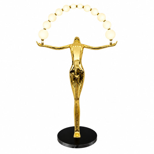 Statue of Liberty floor lamp with a tall figure sculpture holding an arc of glowing glass orbs in a living room