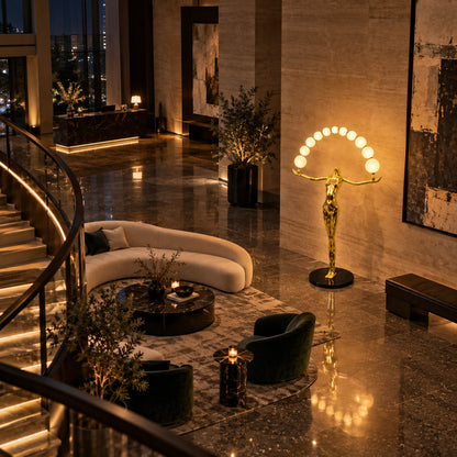 Statue of Liberty floor lamp as a dramatic sculptural focal point in a luxury hotel lobby