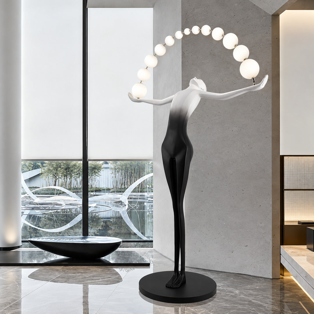 Statue of Liberty floor lamp as a dramatic sculptural focal point in a luxury hotel lobby