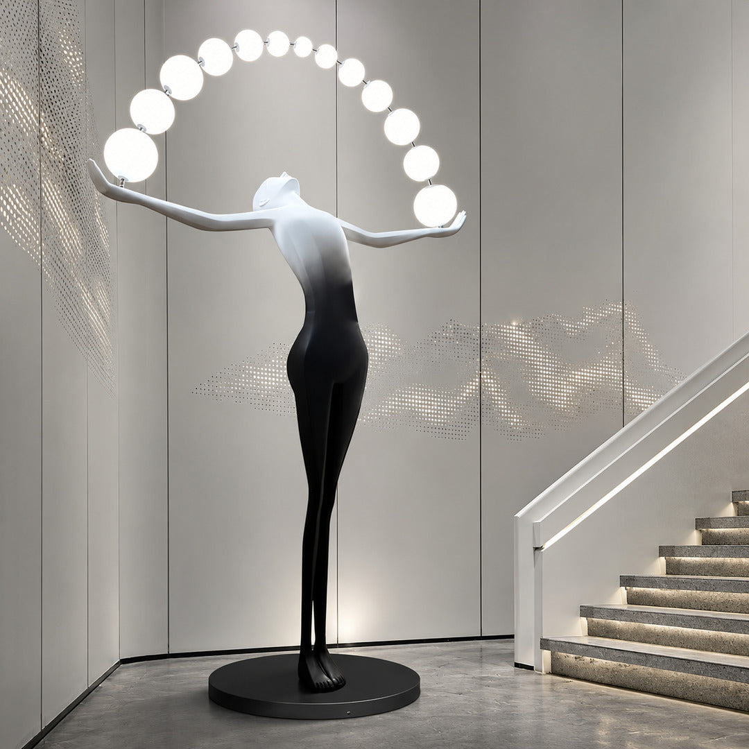 Statue of Liberty floor lamp as a dramatic sculptural focal point in a luxury hotel lobby