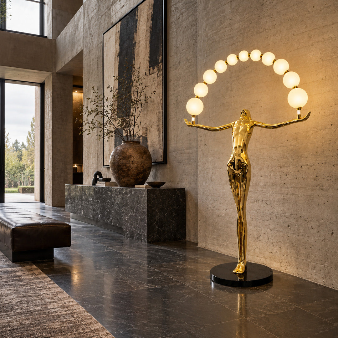 Statue of Liberty floor lamp welcoming guests with a glowing arc of orbs in a grand entryway
