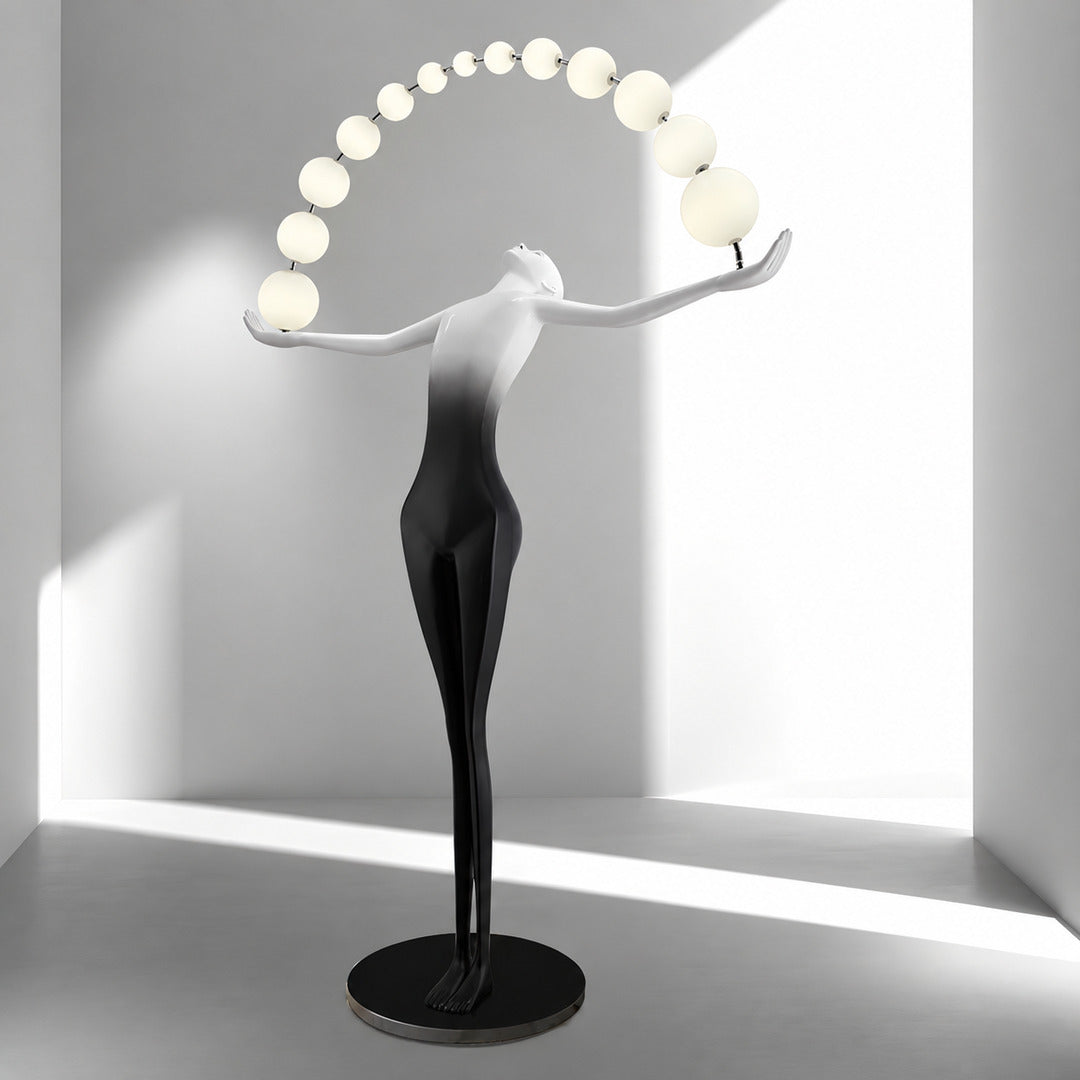 Statue of Liberty floor lamp displayed as a functional light sculpture in a contemporary gallery