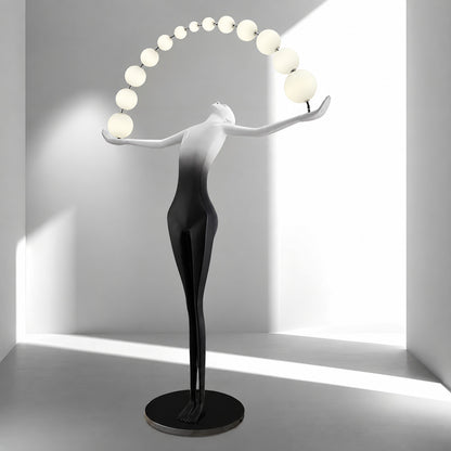 Statue of Liberty floor lamp displayed as a functional light sculpture in a contemporary gallery
