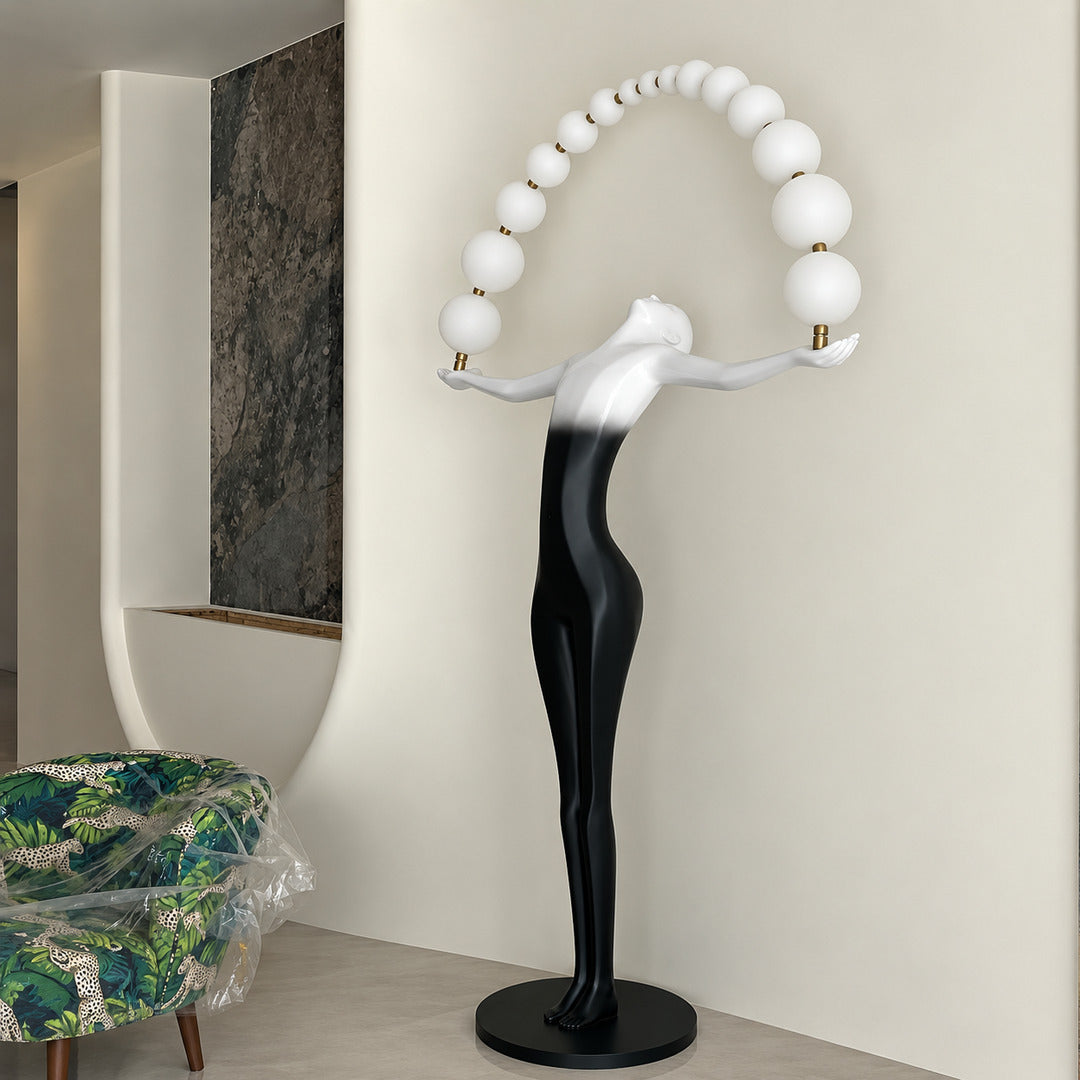 Statue of Liberty floor lamp standing as a dramatic sculptural centerpiece in a modern living room