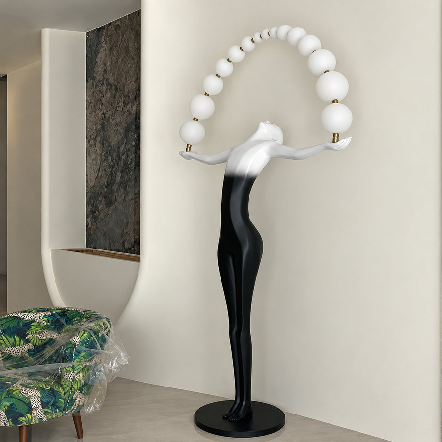 Statue of Liberty floor lamp standing as a dramatic sculptural centerpiece in a modern living room