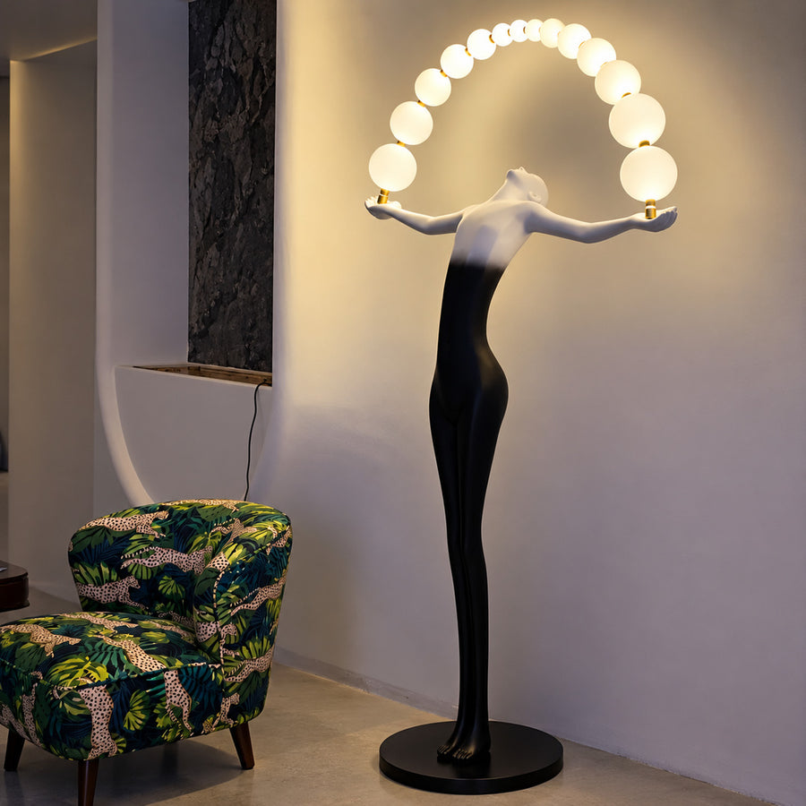 Statue of Liberty floor lamp standing as a dramatic sculptural centerpiece in a modern living room