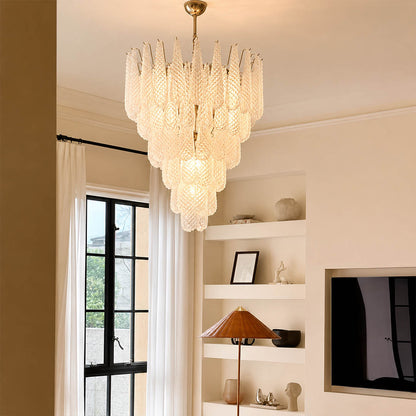 Stella Murano glass teardrop chandelier polished gold frame living room art deco Hollywood Regency Italian luxury warm glow lifestyle interior