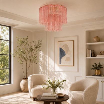 Modern American living room with the exact smoky-gray Stellina ceiling light. Pale stone, dark wood, ivory sofa, natural daylight, and subtle warm glow.