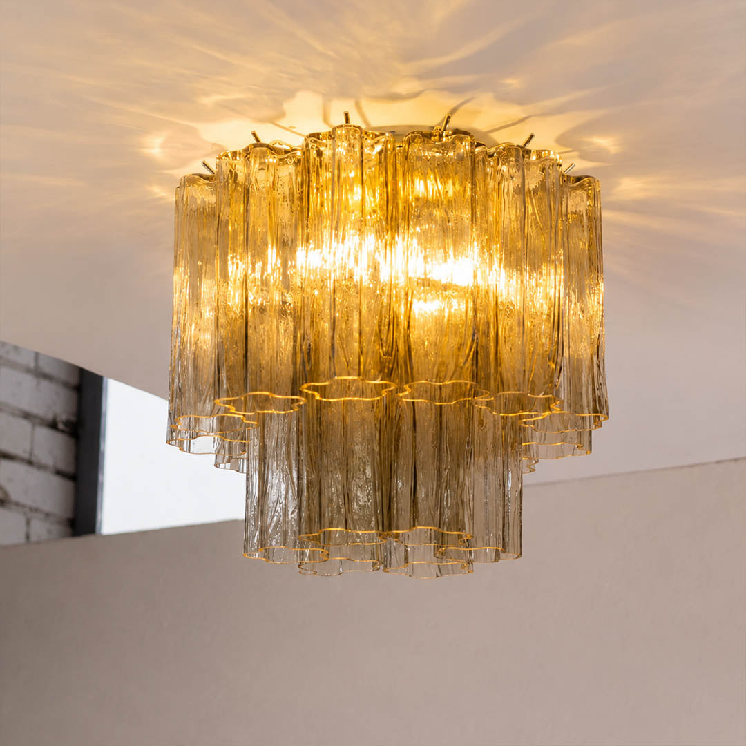 Close-up of warm light passing through the textured glass tubes. Keep the original glass color visible and avoid overexposure.