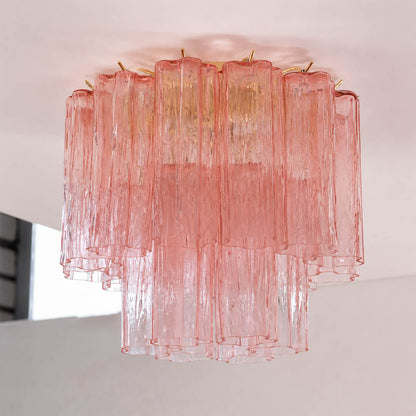 Pure white background, exact Stellina ceiling light with translucent dusty-pink glass and polished gold frame. Light off, centered three-quarter view, realistic material texture, no props or text.