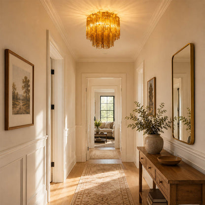 Elegant American hallway with one or two white Stellina ceiling lights. Warm-white paneling, light wood flooring, artwork, and soft daylight.