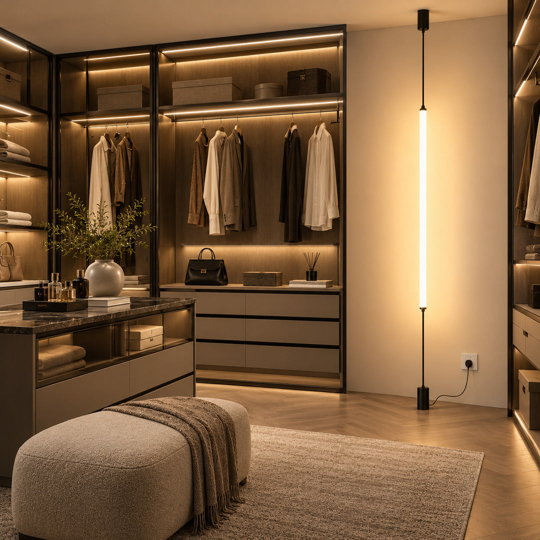 Black Stelo vertical LED lamp turning an empty living room corner into a sculptural light feature
