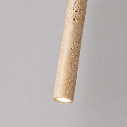 Stelo travertine pendant light illuminated warm light glowing stone veining amber detail