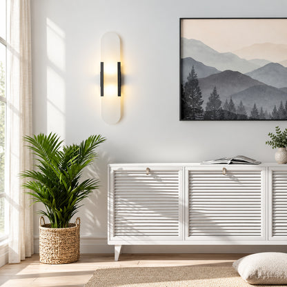 Two Stilo alabaster wall sconces flanking a fireplace for a symmetrical warm glow