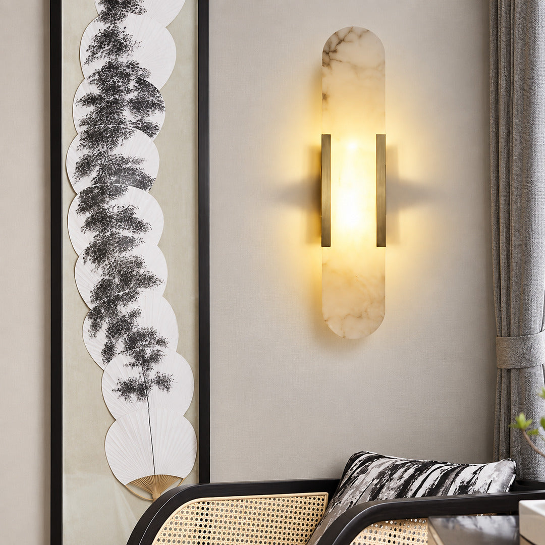 Stilo alabaster wall sconce as a slim warm accent on a modern living room wall
