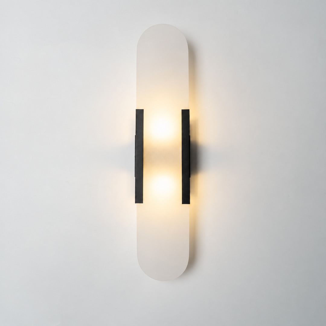 Tall 19.7-inch black Stilo alabaster wall sconce as a bold vertical accent in a living room