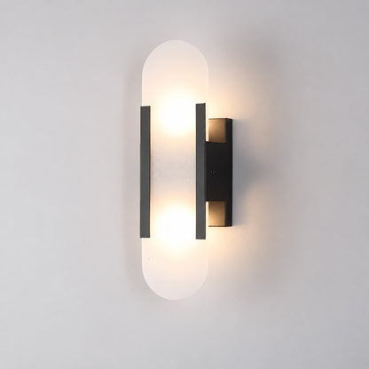 Short 13.8-inch black Stilo alabaster wall sconce on a modern hallway wall
