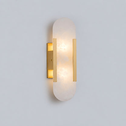Short 13.8-inch brass Stilo alabaster wall sconce as a slim accent beside a bed