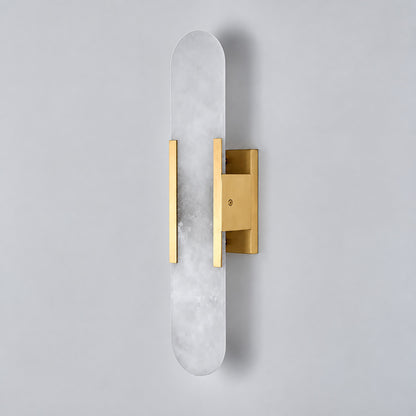 Close-up of the slim cylindrical alabaster shade on the Stilo wall sconce lit from within
