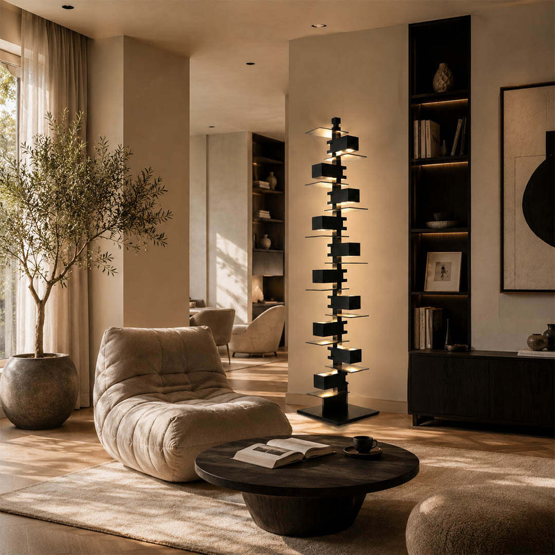 Strato floor lamp black modern living room reading armchair corner statement art deco layered Prairie School inspired warm ambient glow architectural intimate sophisticated lifestyle interior American home