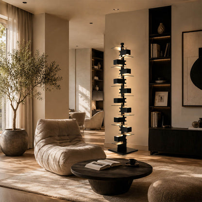 Strato floor lamp black modern living room reading armchair corner statement art deco layered Prairie School inspired warm ambient glow architectural intimate sophisticated lifestyle interior American home