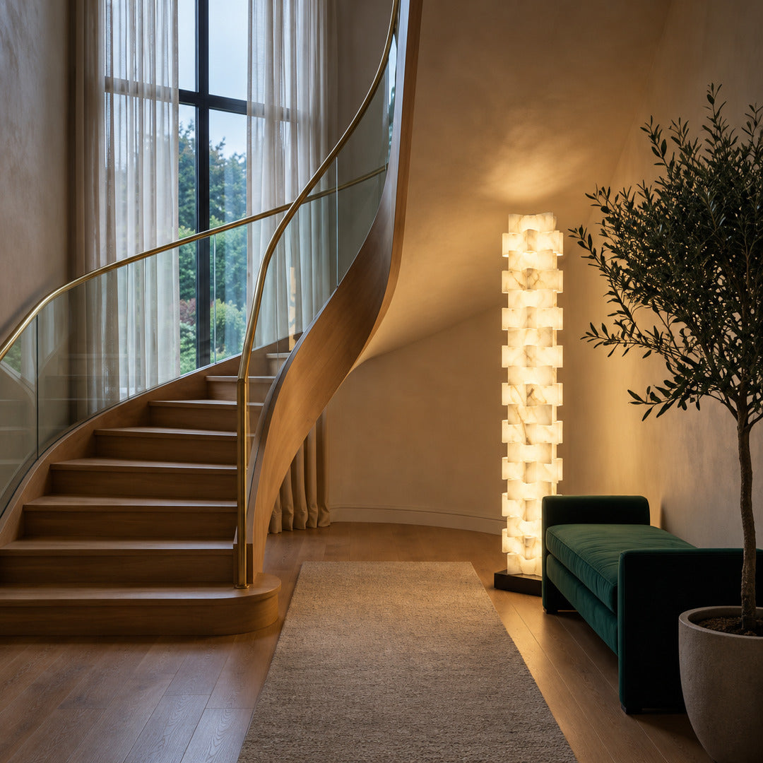 Strato alabaster floor lamp under a sloped ceiling in an attic bedroom
