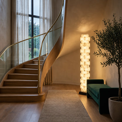Strato alabaster floor lamp under a sloped ceiling in an attic bedroom