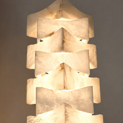 Close-up of natural veining glowing through the stacked alabaster blocks of the Strato floor lamp