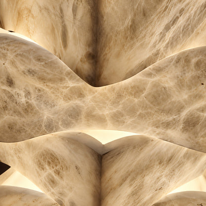 Close-up of natural veining glowing through the stacked alabaster blocks of the Strato floor lamp