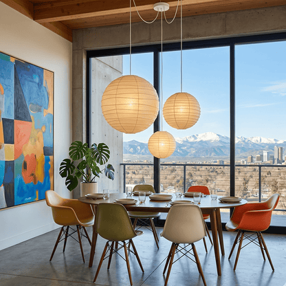 "Stuber handcrafted washi paper sphere pendant light emitting a warm, diffuse glow for minimalist Japandi interiors."