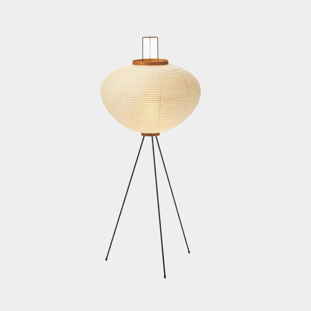 Stuber premium handcrafted off-white washi paper tripod floor lamp with black legs illuminating a modern Japandi living room.
