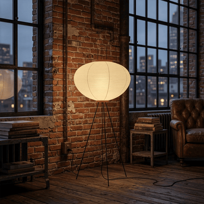 Stuber premium handcrafted off-white washi paper tripod floor lamp with black legs illuminating a modern Japandi living room.