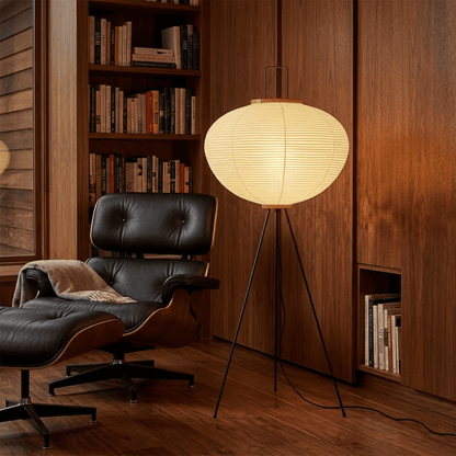 Stuber premium handcrafted off-white washi paper tripod floor lamp with black legs illuminating a modern Japandi living room.