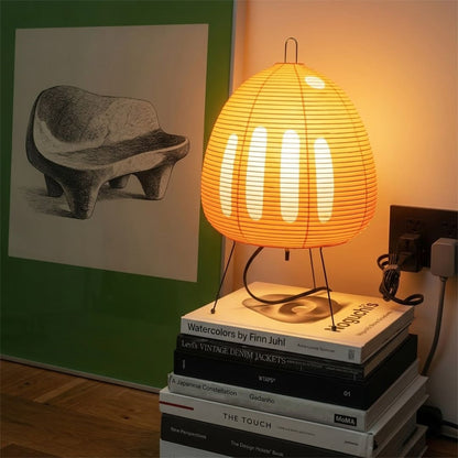 Stuberlighting classic egg-shaped Washi paper table lamp on black tripod legs.