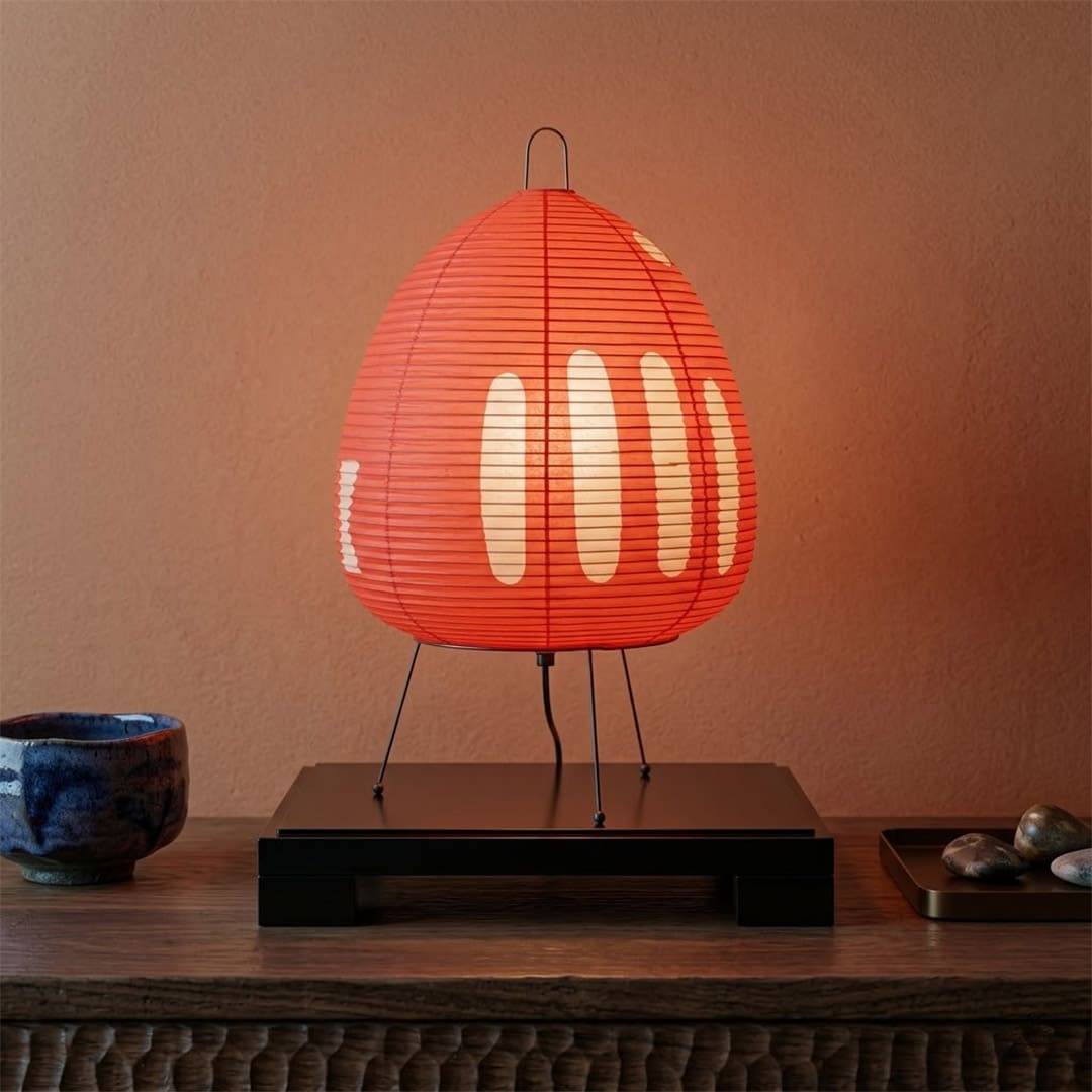 Stuberlighting classic egg-shaped Washi paper table lamp on black tripod legs.