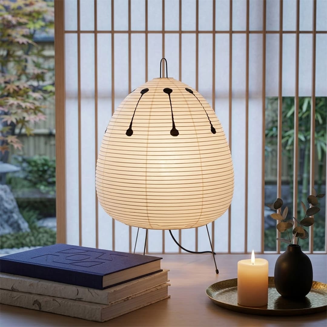 Stuberlighting classic egg-shaped Washi paper table lamp on black tripod legs.