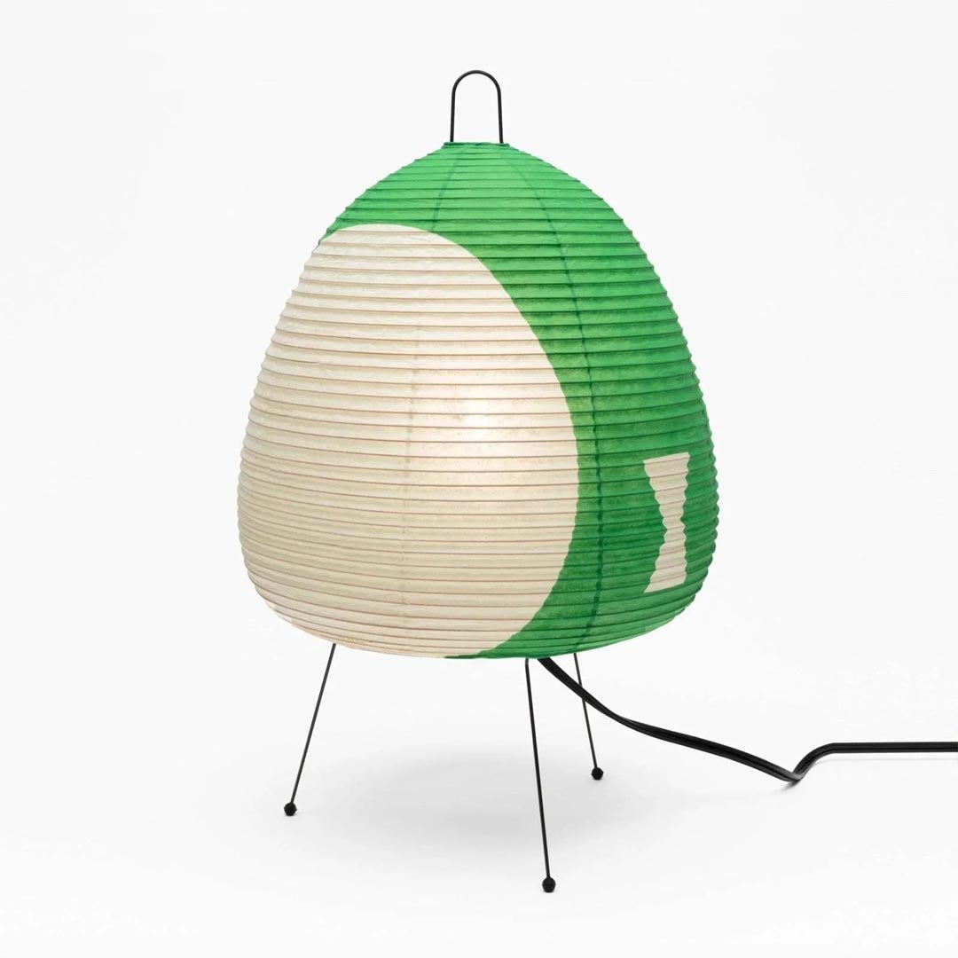 Stuber classic egg-shaped Washi paper table lamp on black tripod legs.
