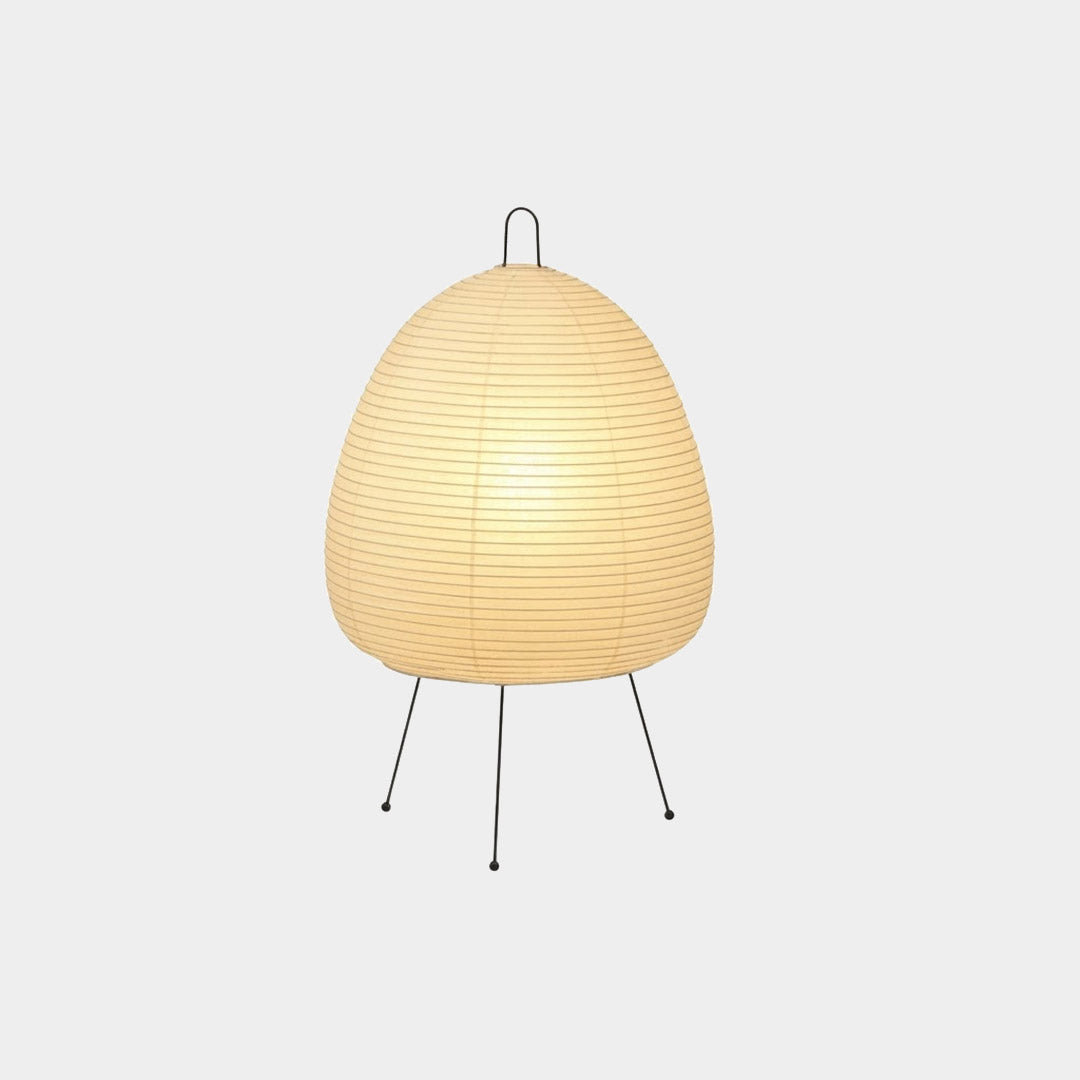 Stuber classic egg-shaped Washi paper table lamp on black tripod legs.