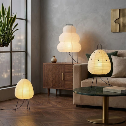 Stuberlighting classic egg-shaped Washi paper table lamp on black tripod legs.