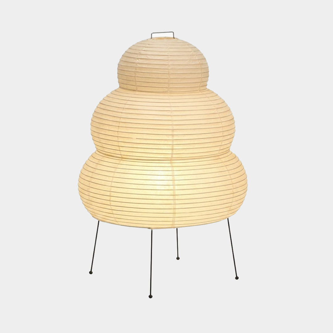 Stuberlighting 25N large Washi paper floor lamp with three-tiered silhouette in a warm minimalist living room setting.
