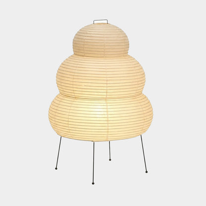 Stuberlighting 25N large Washi paper floor lamp with three-tiered silhouette in a warm minimalist living room setting.