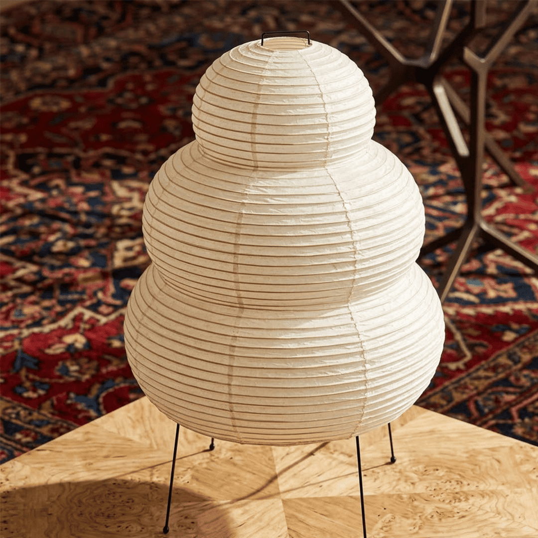 Stuberlighting 25N large Washi paper floor lamp with three-tiered silhouette in a warm minimalist living room setting.